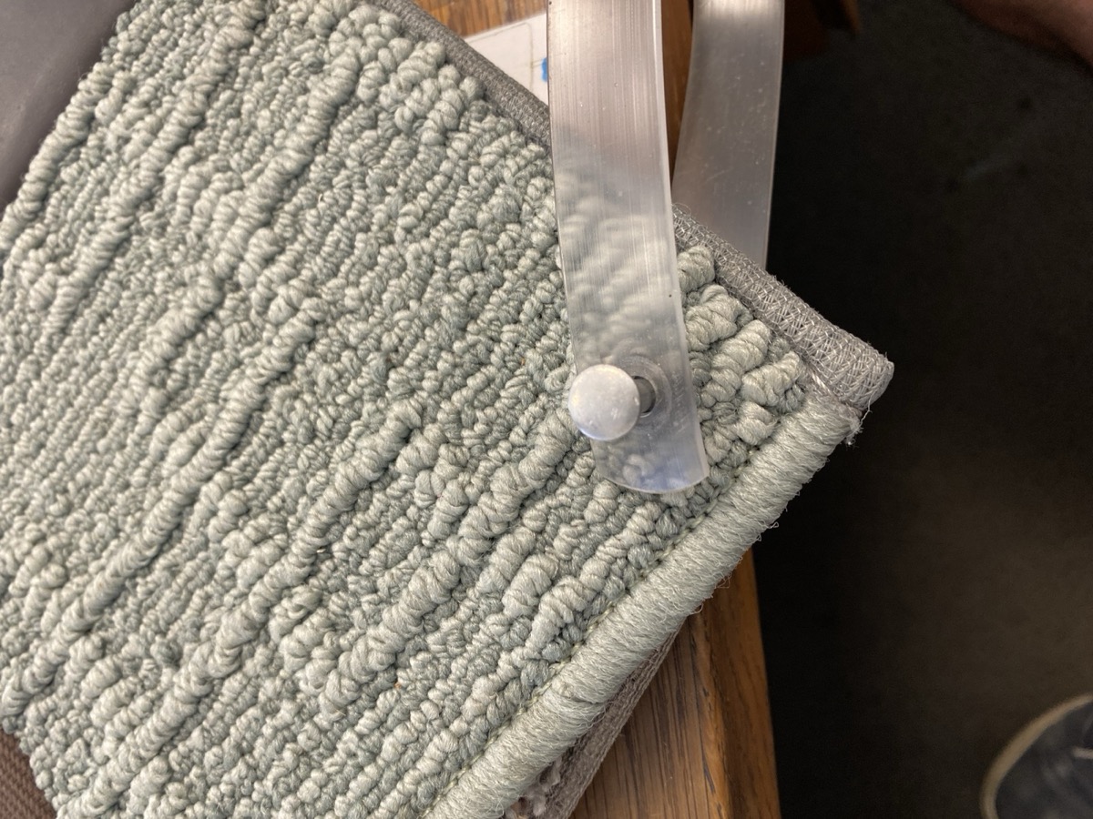 Polyester showroom sample &mdash; serging on top-left, standard binding on the bottom edge